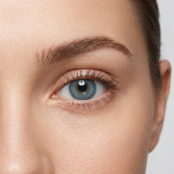 Orama Blewy Green colored contact lens shown on a single eye