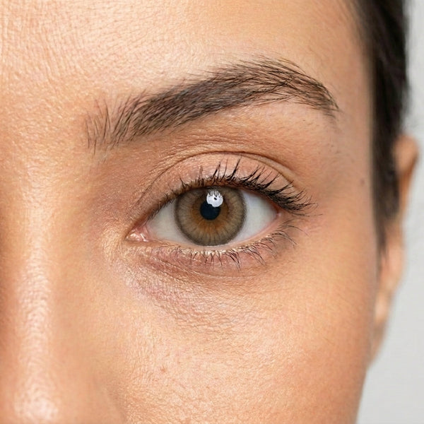 Orama Honey Wood colored contact lens shown on a single eye