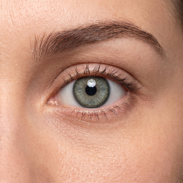Orama Glam Green colored contact lens shown on a single eye